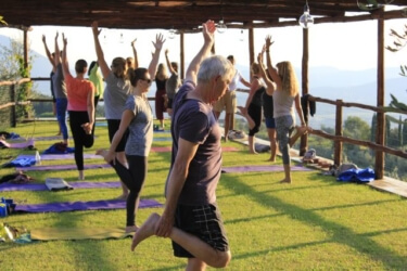 Outdoor Yoga Platform overlooking vineyards and olive groves at Il Borghino. Yoga Retreat Italy